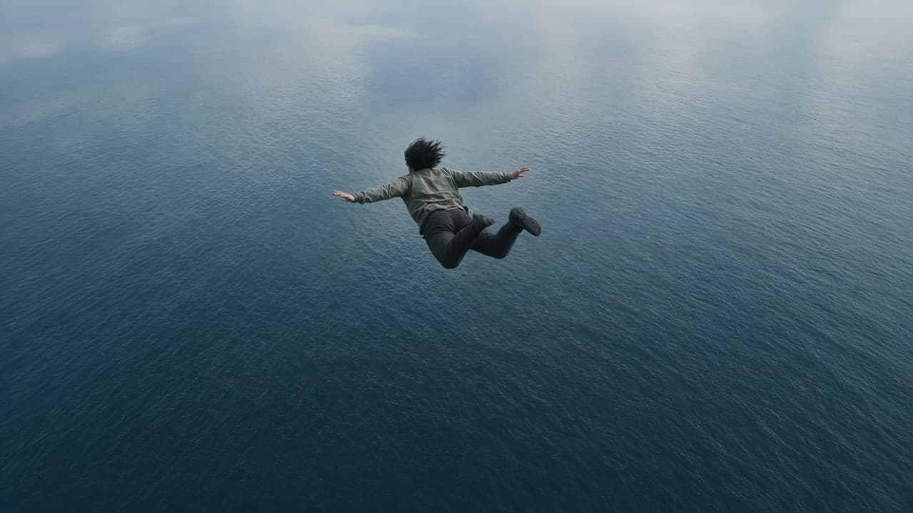 A person falling toward dark water in a dream